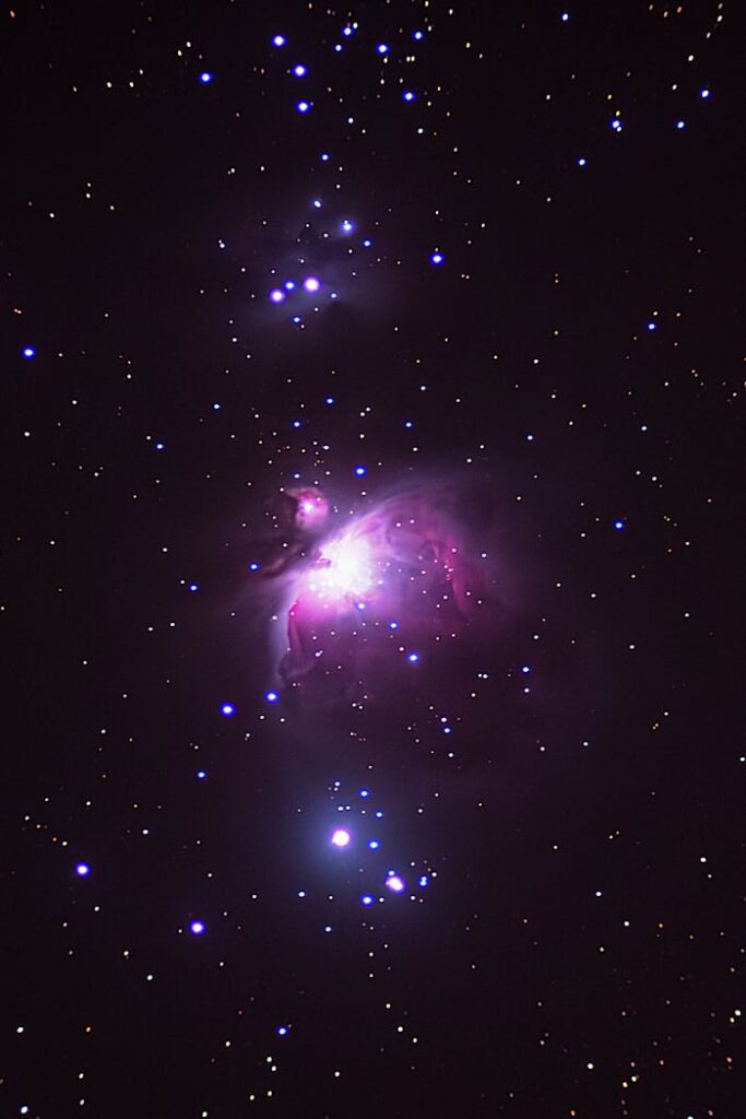 A captivating view of the Orion Nebula amidst a dense star field creating a cosmic spectacle.