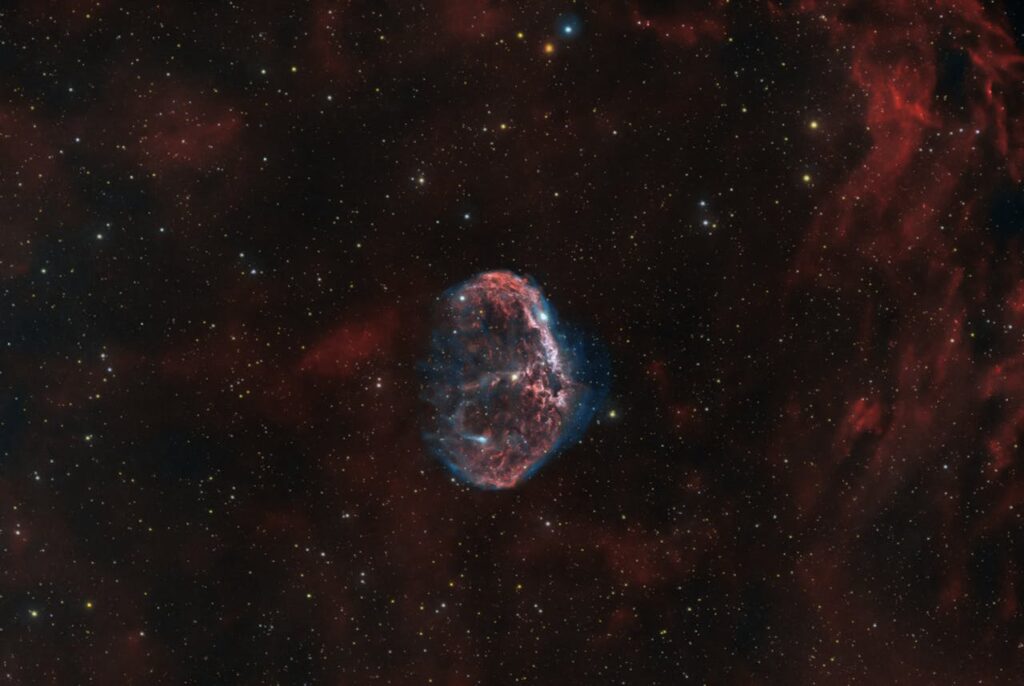 A breathtaking high-resolution image of a nebula in deep space, showcasing vibrant colors.